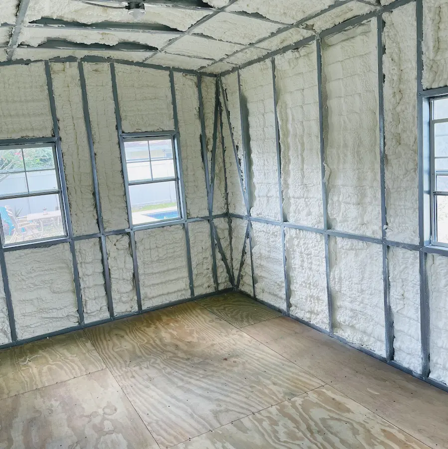 Closed-cell spray foam insulation applied to wall cavities in a residential project in Smiths Station